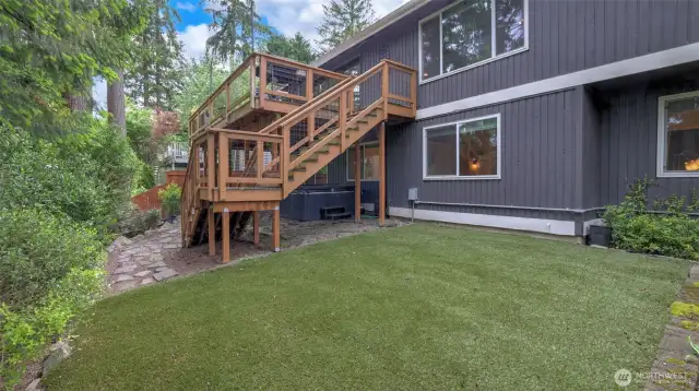 Fully fenced yard with easy maintenance turf