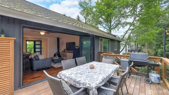 Entertaining made easy on the spacious deck featuring composite decking and stairs leading down to the yard
