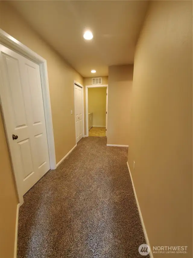Spacious hallways connect all bedrooms, bathrooms and laundry room. Brand new carpets too!