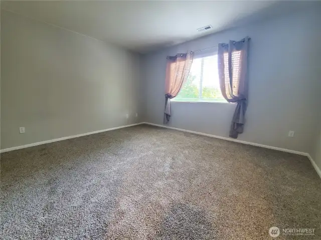 Main suite/bedroom on the 2nd floor. Brand new carpets. Peek-a-boo views of Mt. Rainier on sunny days!