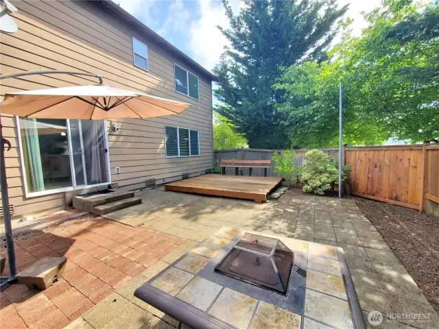 Expansive backyard features a new deck and seating bench added in 2020.