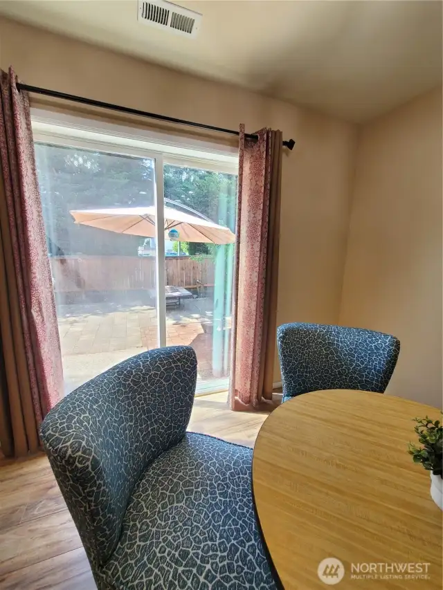 From the dining area, enjoy the outdoor space just outside the sliding doors.