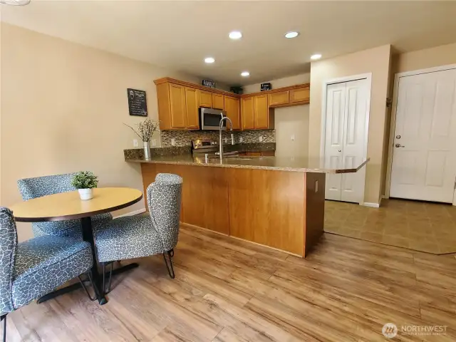 Closer view of the dining area and kitchen.