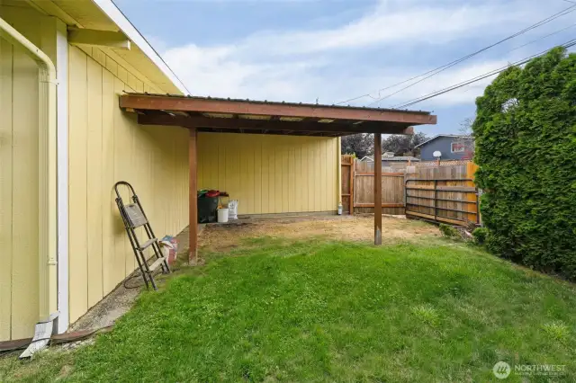 Covered carport off the alley.