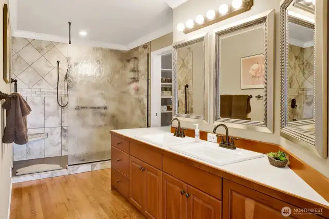 Twin sinks, hardwood floors & oversized custom walk in shower with double heads for plenty of options!