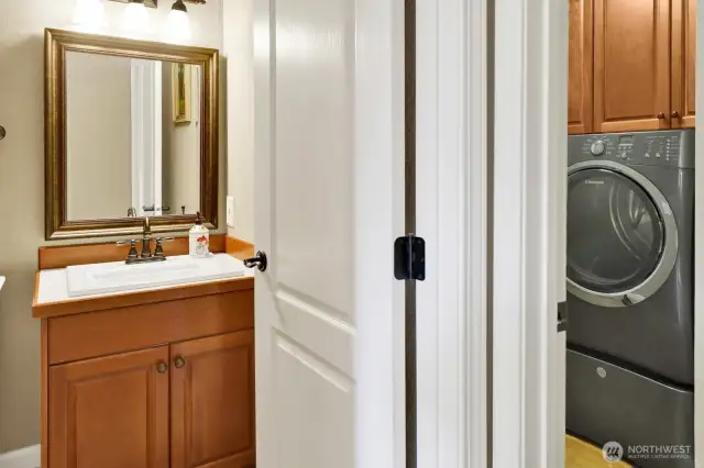 A half bath joins the laundry room in the hallway to the garage.