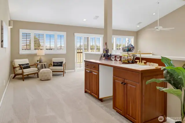 On the loft, this inviting space includes a wet bar & sitting room with access to the upper level lanai.