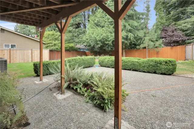 Concrete aggregate patio off of lower level daylight basement.