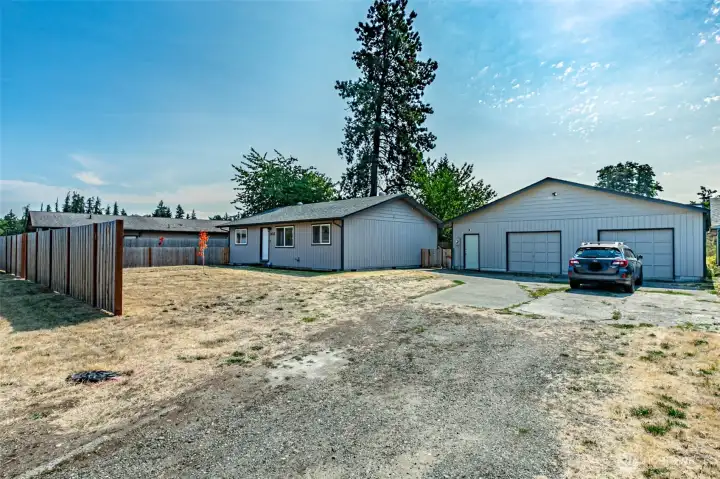 You'll be so surprised by all the upgrades on the interior of this home.  Including WHOLE HOUSE AIR CONDITIONING!  10,000 sq ft lot with 3 b3droom & 1 3/4 baths.  1,720 sq ft 4 car garage with large attached shop space.