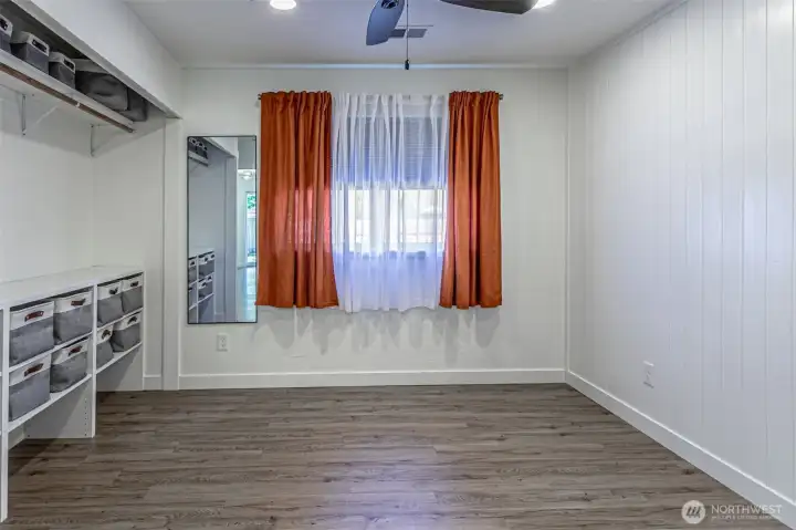 Primary bedroom with large closet & basket organizing system that stays.