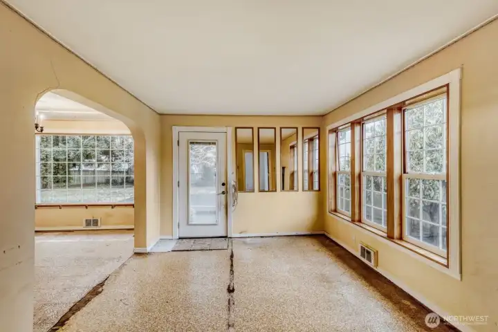 Living room looking towards front door with dining to the left.