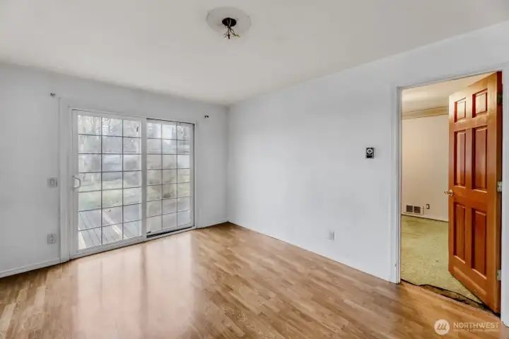 Bedroom that opens to back yard and deck.