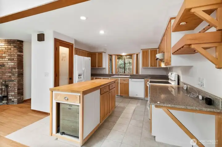 Island in Kitchen has built-in wine fridge.