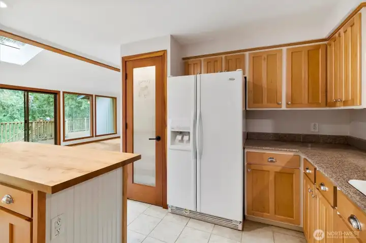 Lighted pantry provides ample storage space.