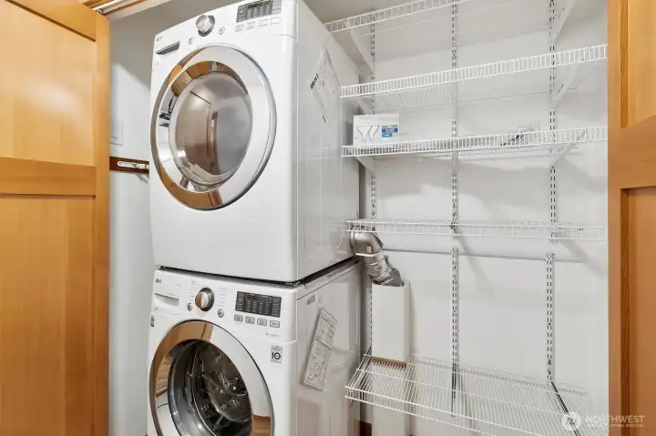 Washer/Dryer +storage closet off hallway next to primary bedroom.