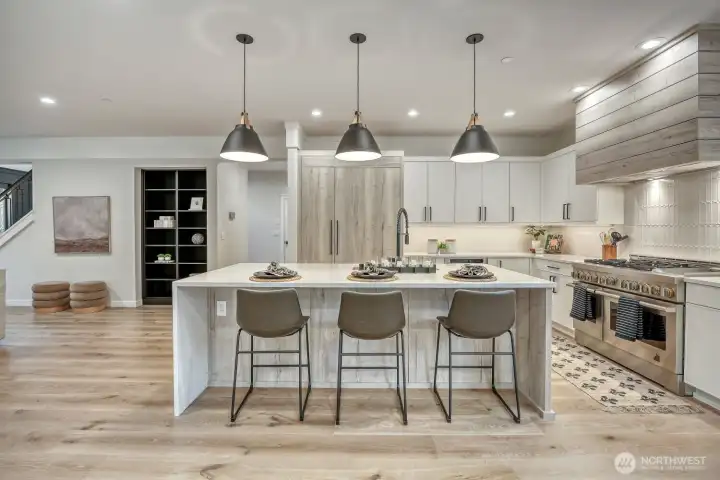 Enjoy expansive island with barstool seating