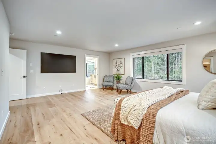 MASSIVE primary bedroom overlooking backyard