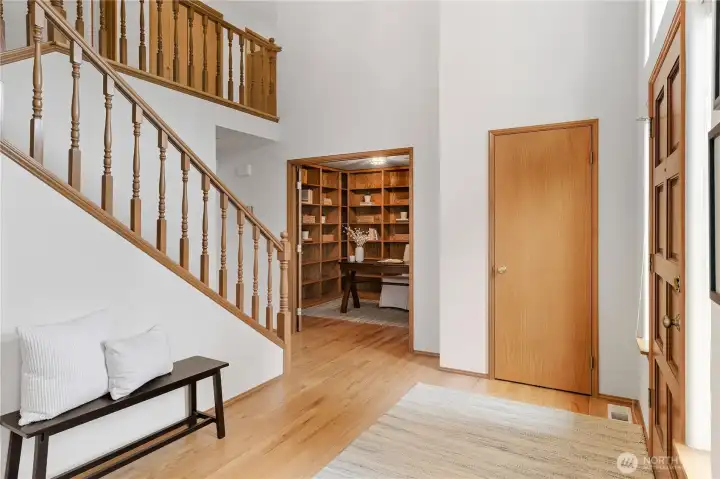Front entry with hardwood stairs that lead to the upper level.