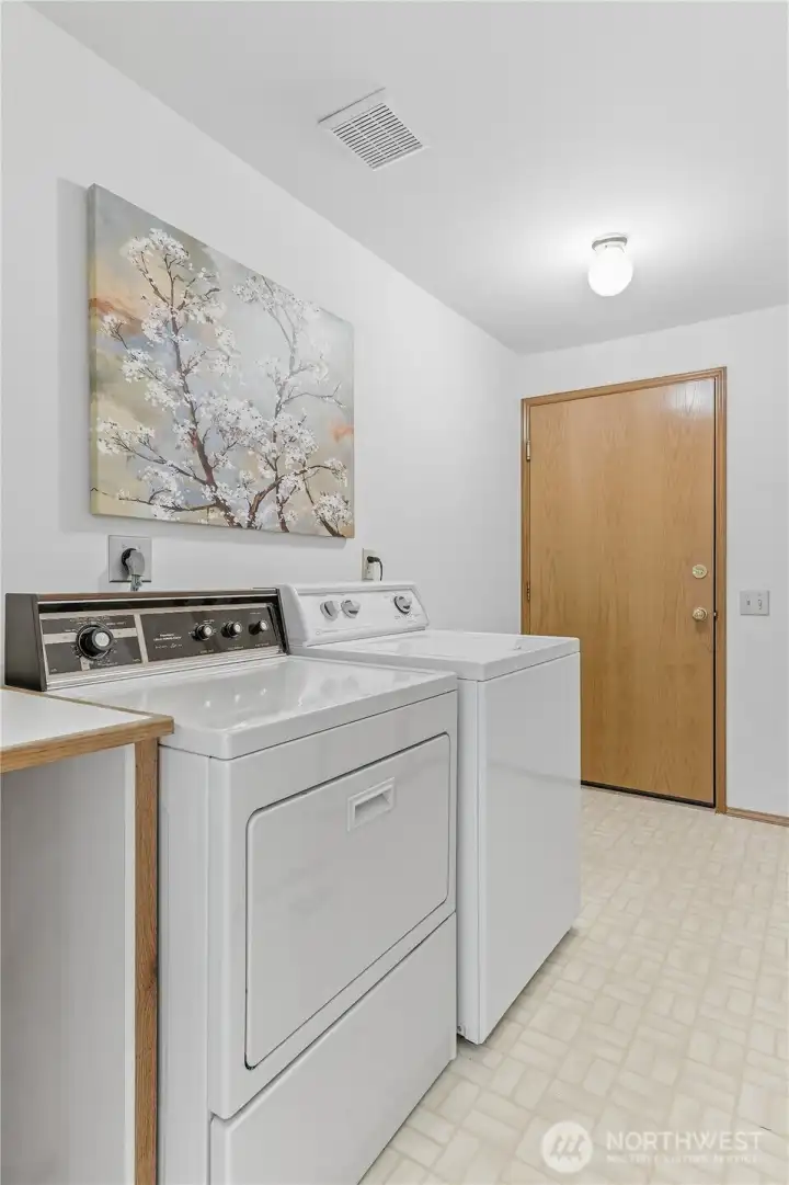 Downstairs laundry/mud room connecting to the garage.