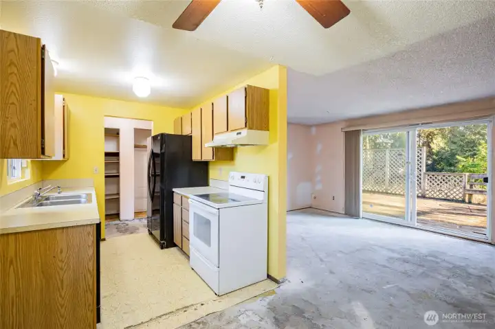 Dining room off of kitchen is open to the living room.