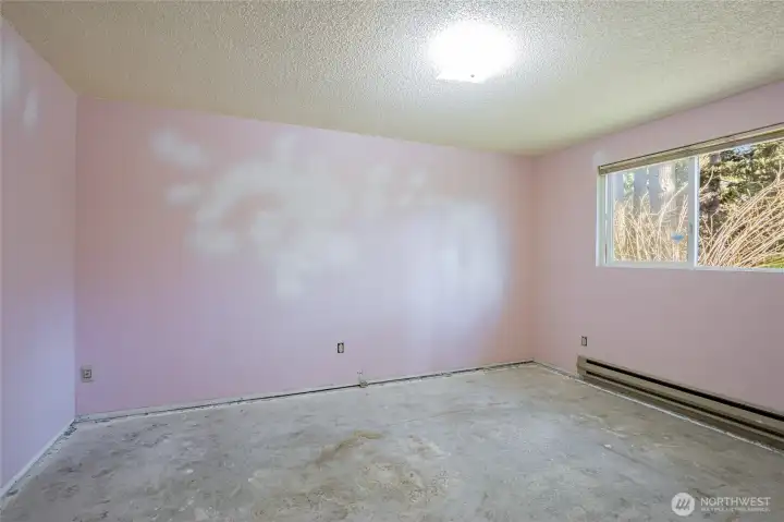 Primary bedroom located at the back of the hallway.