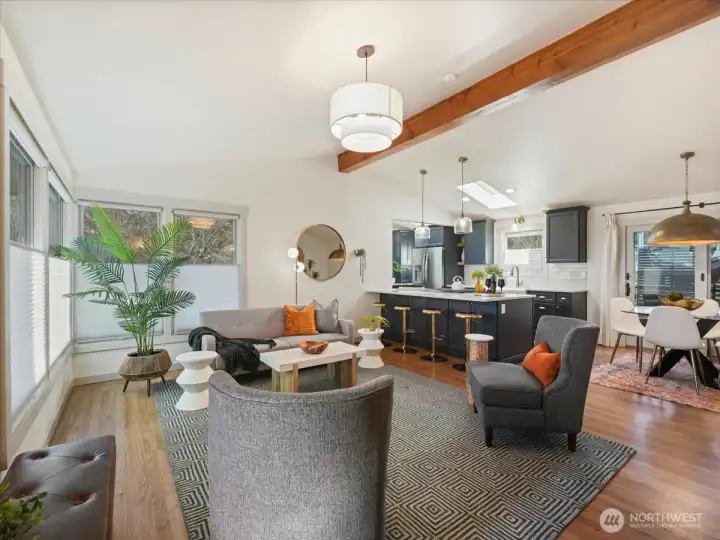 Gorgeous kitchen remodel with a wall removed to open up the space creating a bright and inviting flow between the kitchen and living room.