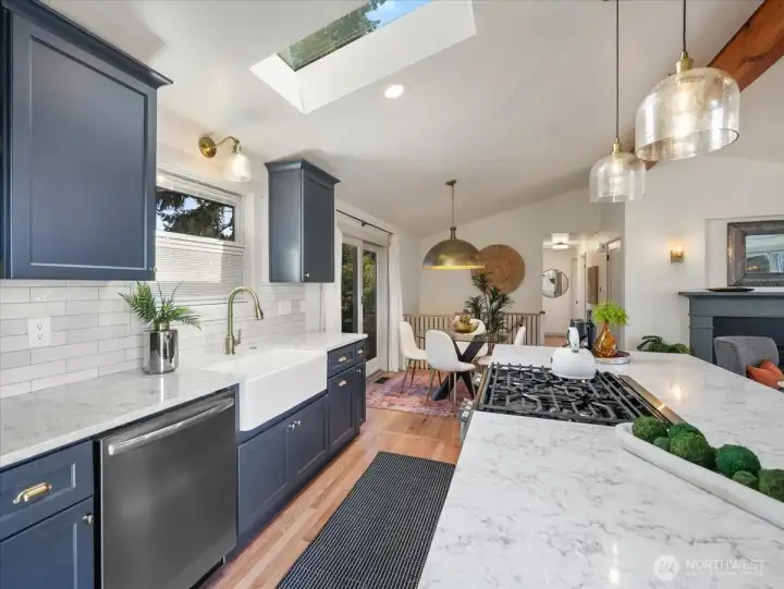 Among the many upgrades in this beautifully remodeled kitchen is an oversized fireclay farmhouse sink, blending style and function seamlessly.