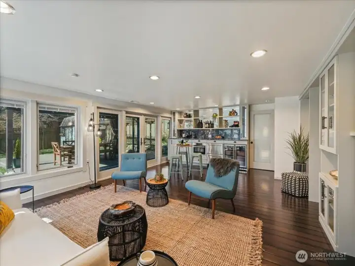 Lower level is suited for a separate living space, featuring a full kitchen and seamless access to an entertainment-sized deck and fully fenced yard.