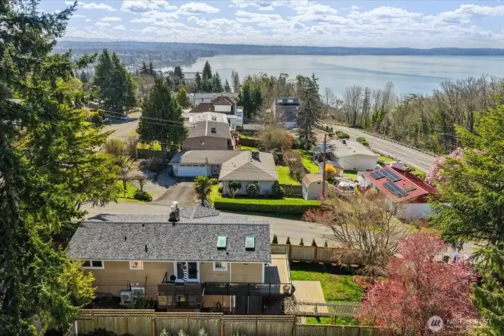 An aerial view beautifully illustrates the home's location to the Sound.