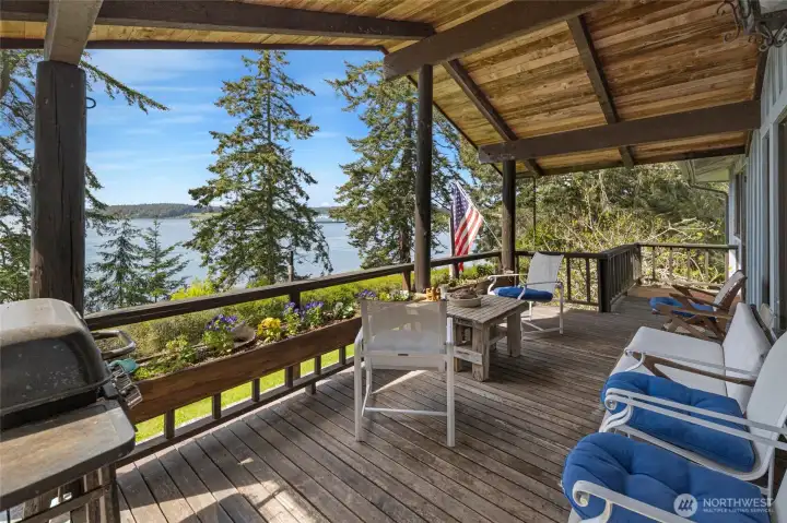The large, covered porch is perfect for watching the passing ferries.