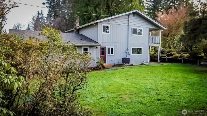 OK...SIDE YARD TOWARD BACK DOOR/UTILITY ROOM