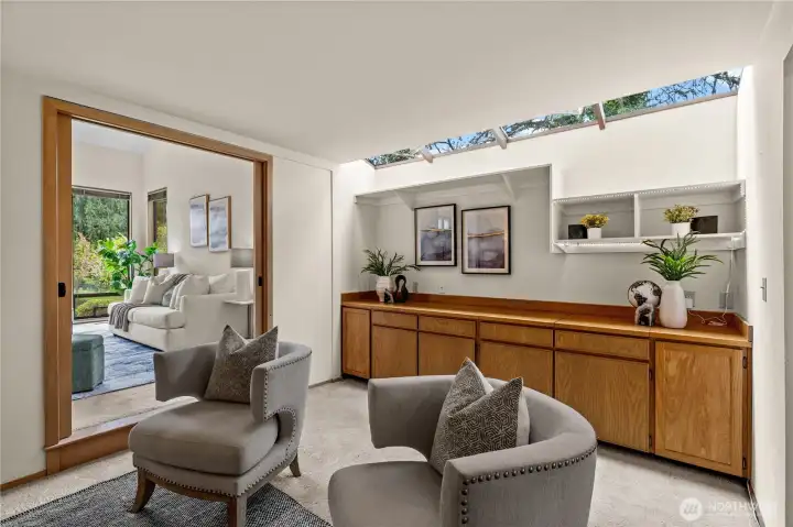 Built-in cabinets can serve equally well as an office storage space or an entertainment area already plumbed for a sink.