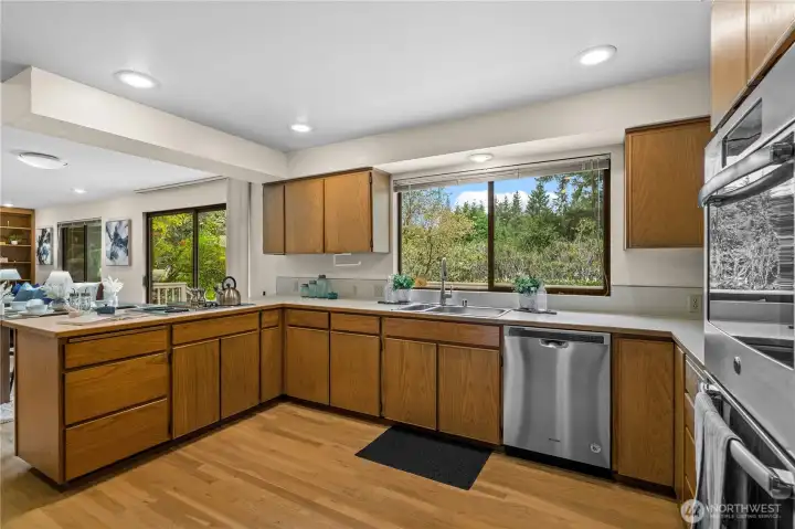 The kitchen blends style and function with hardwood cabinetry and stainless appliances sure to please the household chef!
