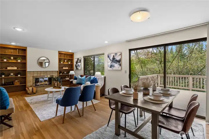 A cozy family room fireplace invites you to relax and features easy access to a large entertainment deck.