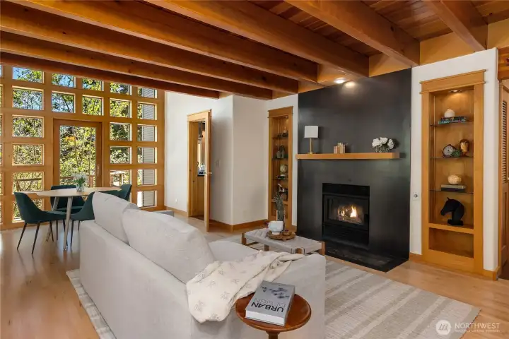 Warmth and character abound with car-decking ceilings, exposed beams, and propane fireplace with steel surround.