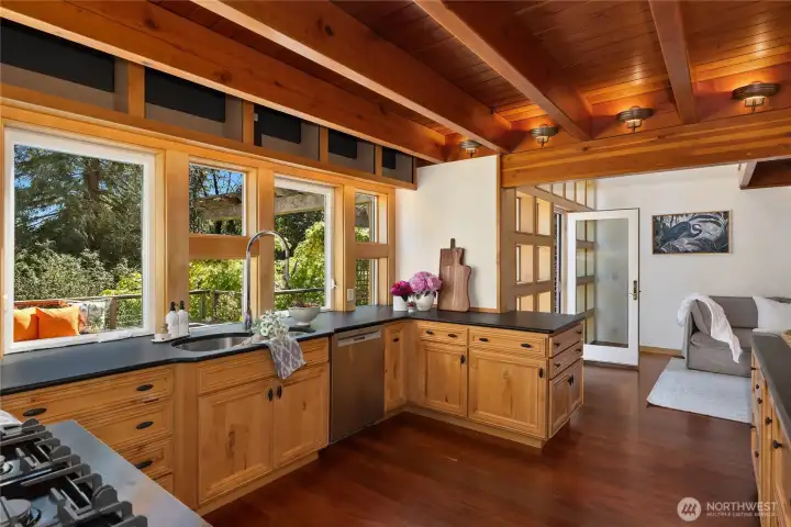 The kitchen flows into a family room which opens to the south-facing deck.