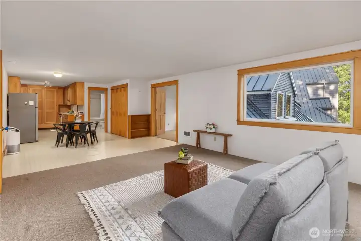 Above, a spacious studio/office awaits your guests.