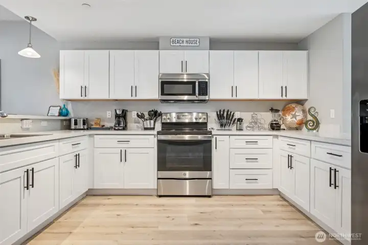 Offering that timeless feel with white cabinetry and stainless steel appliances