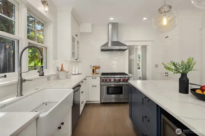 Wolf range, farm house sink, entertaining island.