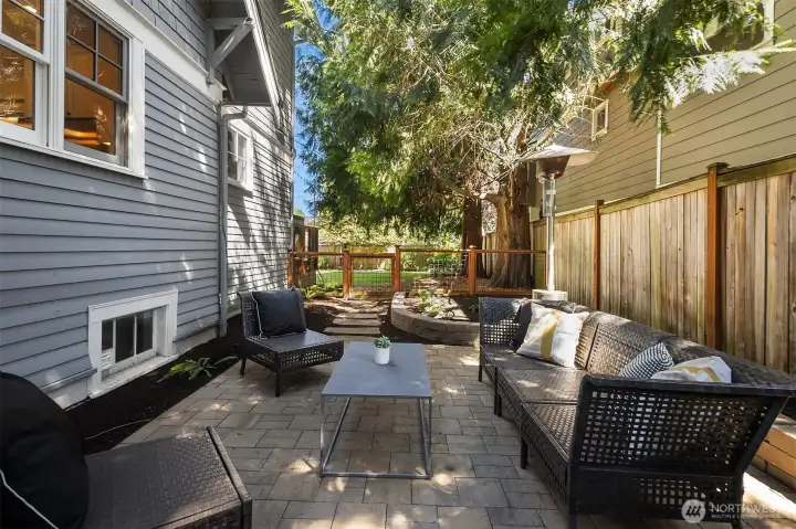 Other side of the home with custom patio.