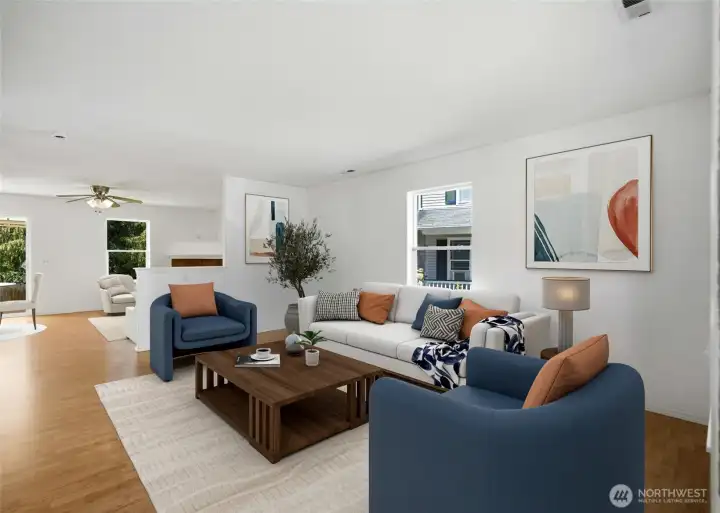 The open-concept living room offers generous space for both everyday living and entertaining. [Photo is virtually staged.]