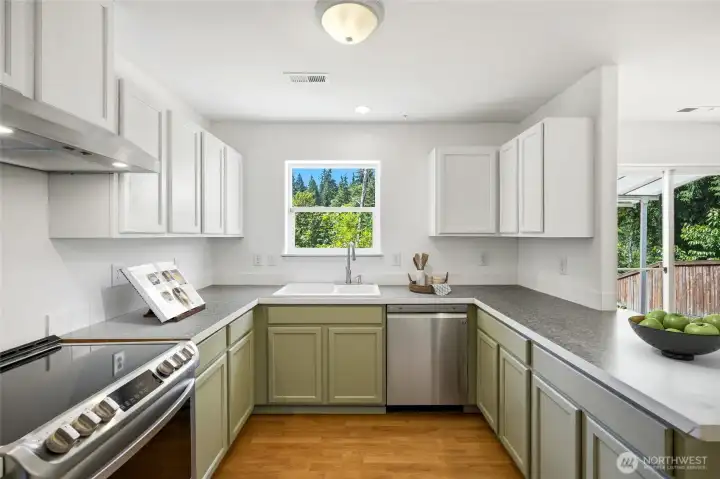 Abundant storage, generous workspace, and timeless finishes make this a kitchen you'll love spending time in. [Photo is virtually staged.]