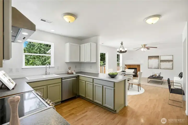 Open sightlines to the family room and dining areas make entertaining effortless. [Photo is virtually staged.]