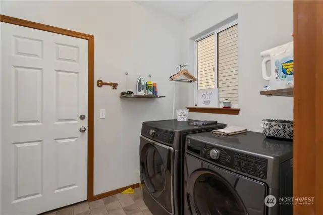 Oversized laundry with full size washer & dryer as well as live edge shelves and pantry (not pictured).