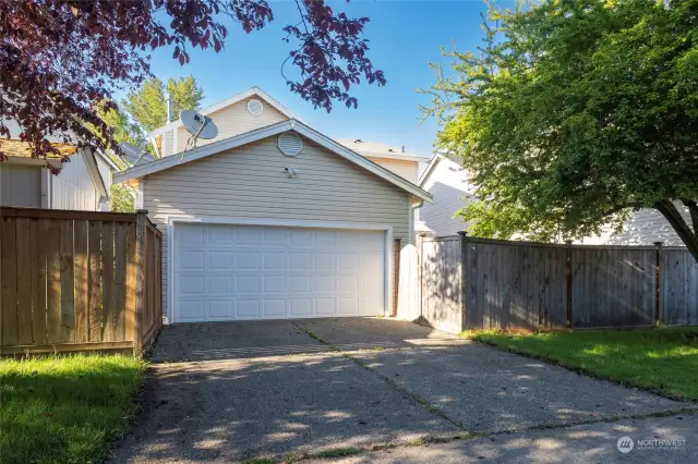Rear loading garage with alley access offers secluded off street parking.