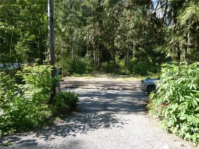 LEVEL ~ .84 Acres surrounded by woods.