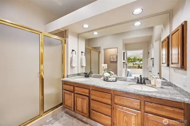 Updated ensuite bathroom featuring a step-in shower for convenience and style.