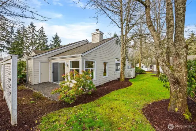 Back patio with easy access to the side of the home.