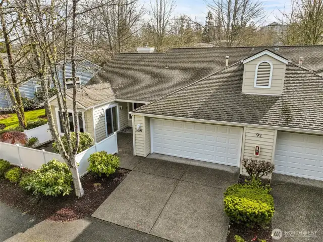 Oversized two-car garage with ample space for storage and parking.