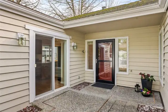 Entry with a convenient slider to the kitchen for easy access and natural light